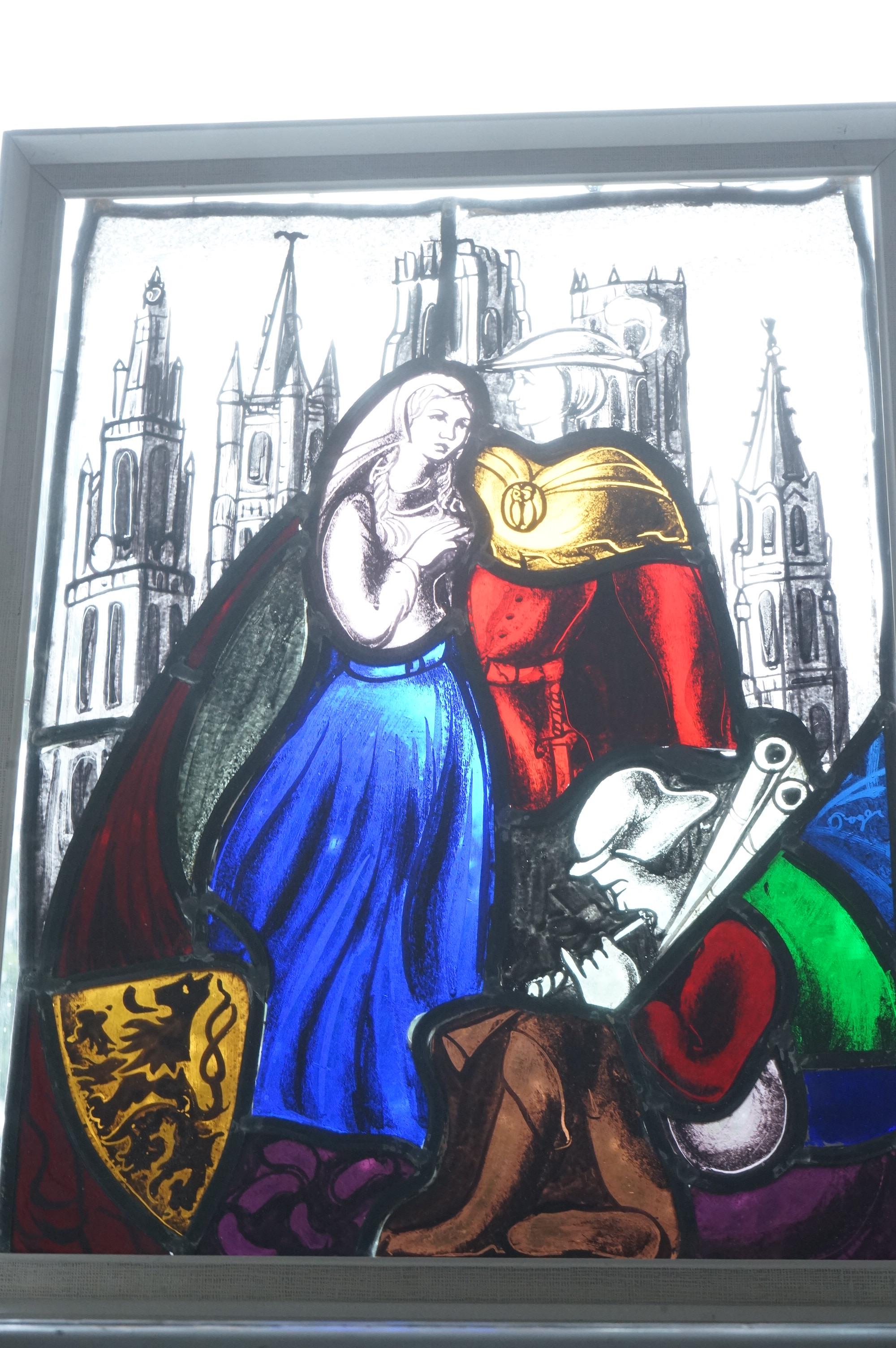 A stained and leaded glass panel of a romantic couple in front of a cathedral, 48cm high